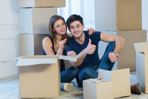 Local packing team preparing fragile household items