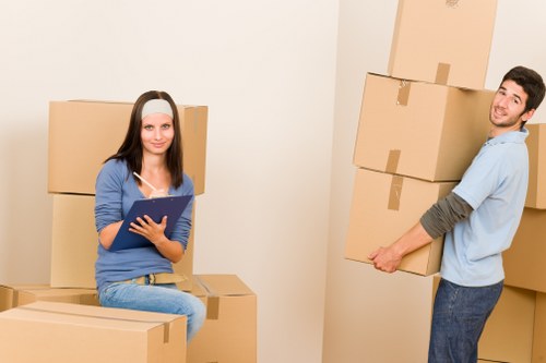 Uxbridge moving team preparing a home relocation with protective equipment